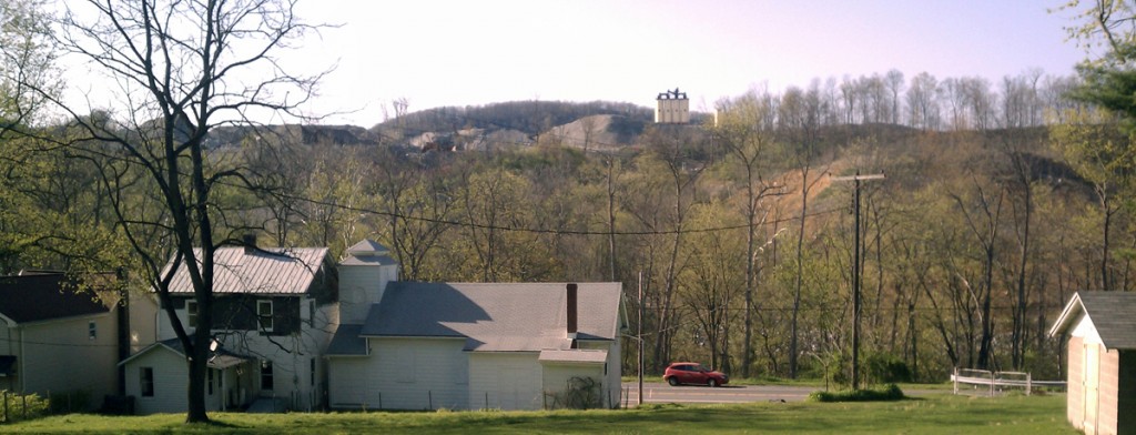 Old and new Ganister, the old St. Mary's Orthodox church in the foreground with the new Grannas Brothers quarry in the background